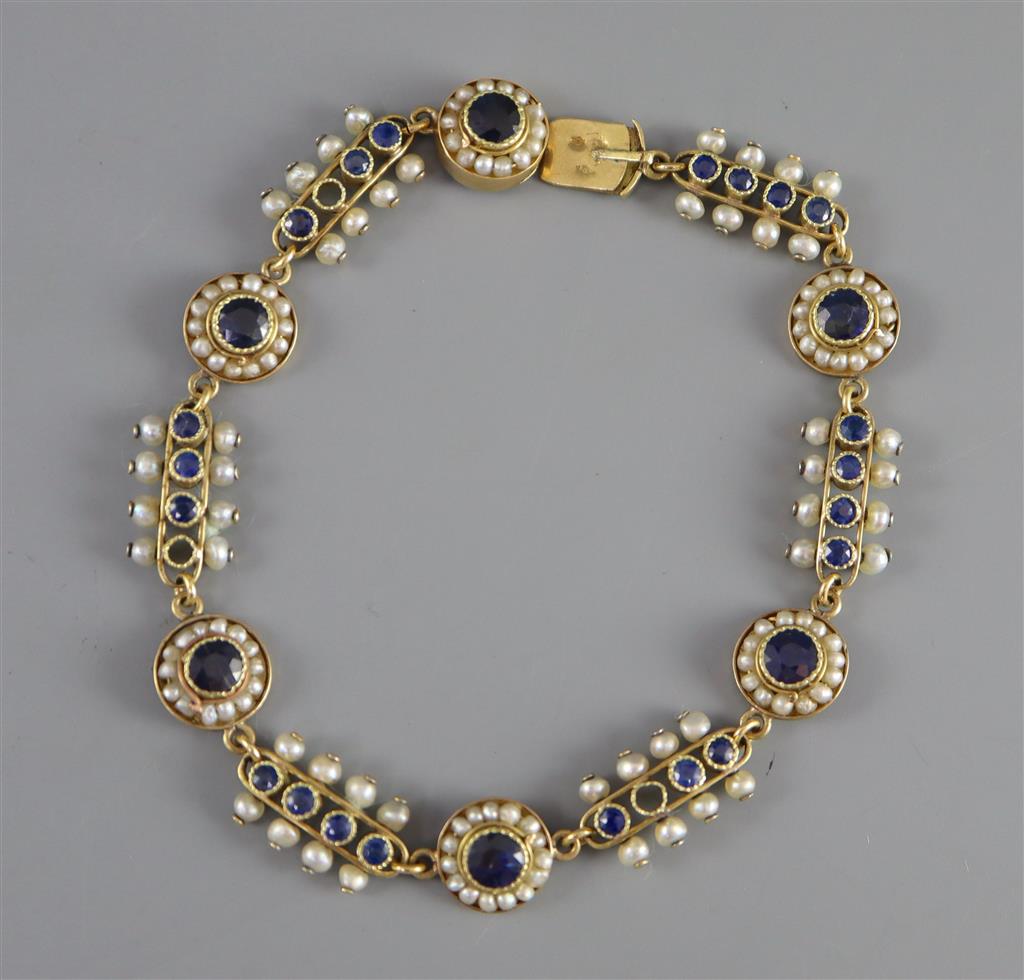 A late 19th/early 20th century French 18ct gold, sapphire and seed pearl set bar and circular link bracelet,